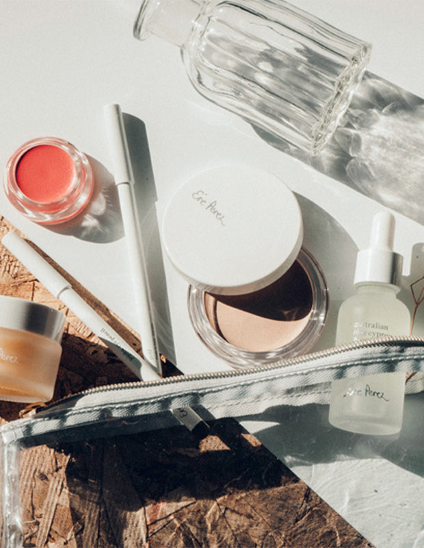 botantic-based skincare by Ere Perez scattered on a white tabletop
