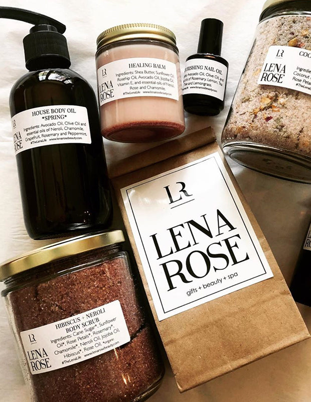 a collection of Lena Rose House Line beauty products on a table