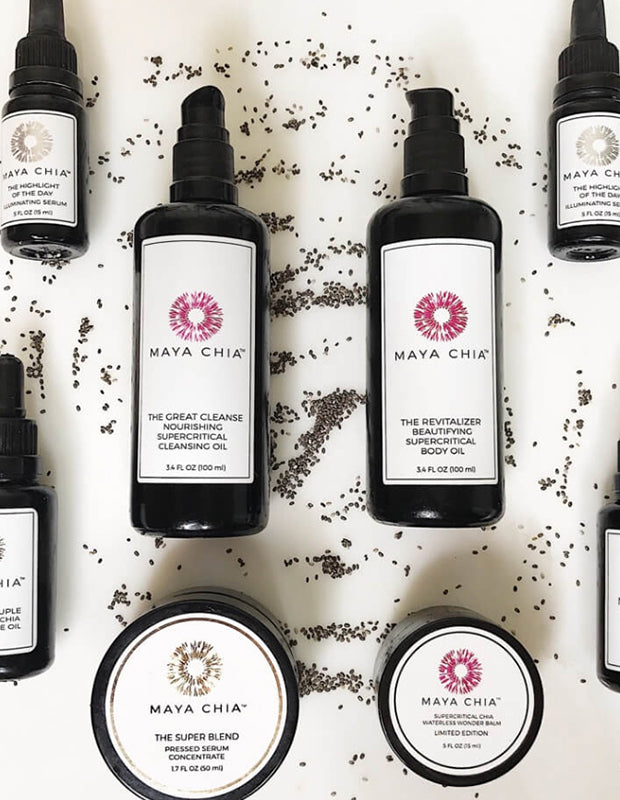 Maya Chia skincare products flat-lay photo with chia seeds scattered around